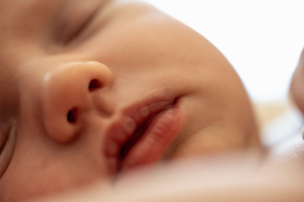 Close-up of a peacefully sleeping newborn